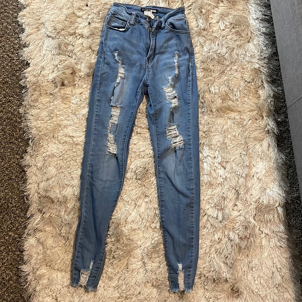 Light washed ripped jeans , FashionNova